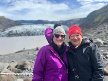 Group enjoying scenic waterfall in Iceland